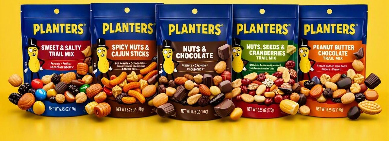 Five bags of Planters trail mix varieties lined up on the shelf