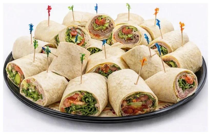 Wrap Party Tray: sliced wraps held with colorful picks on a round black tray